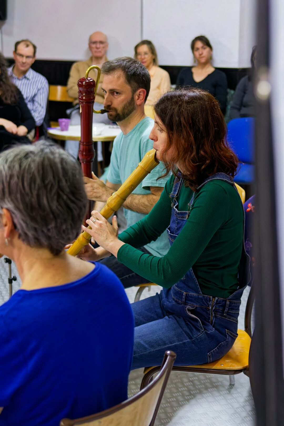 Group of professionals in a bright coworking space during a knowledge sharing workshop